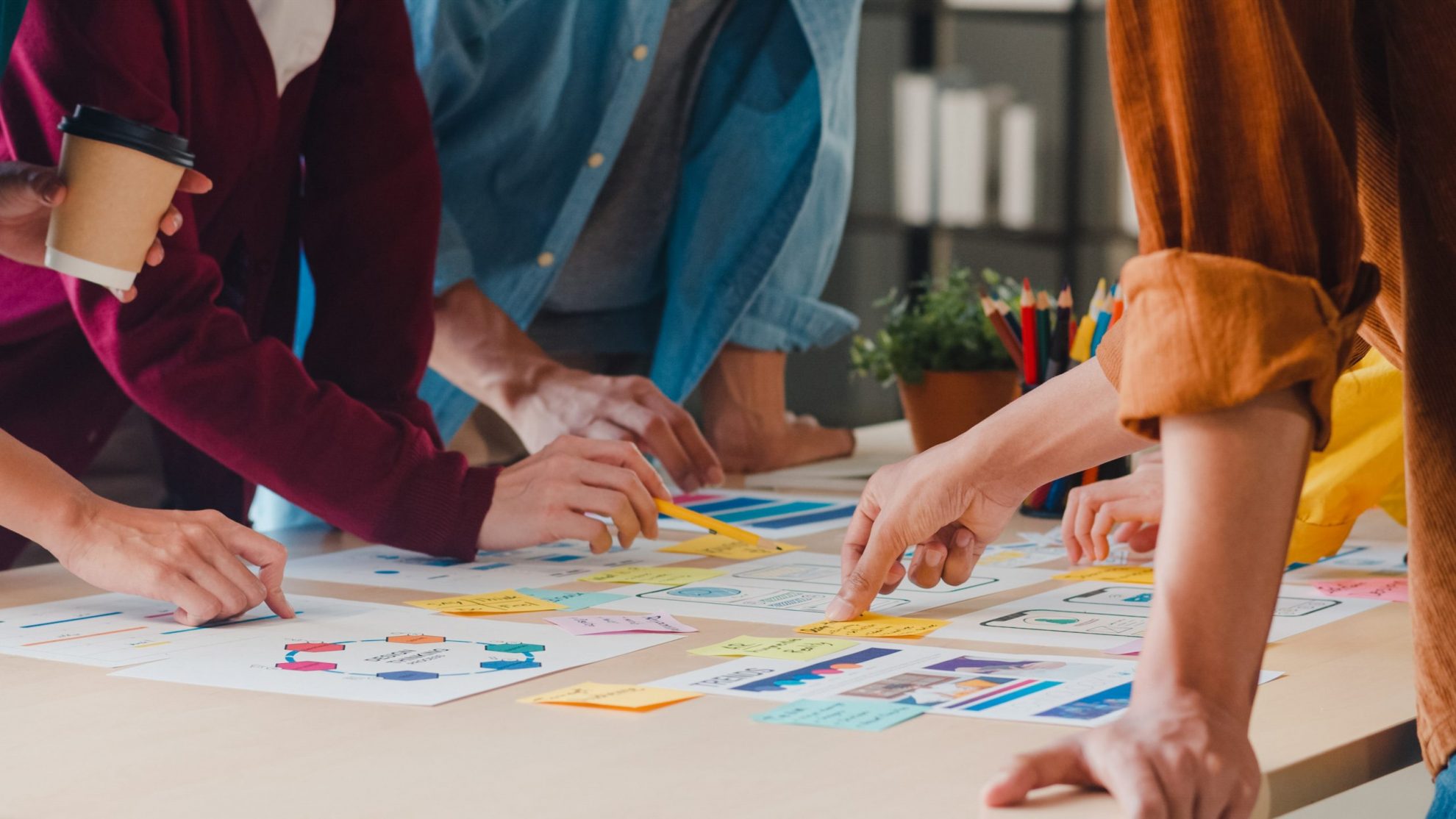Photo of people working together illustrates blog: "How to be more creative at work"