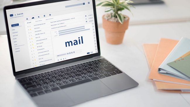 Photo of laptop with screen that reads "mail" illustrates blog: "How To Write Better Emails"