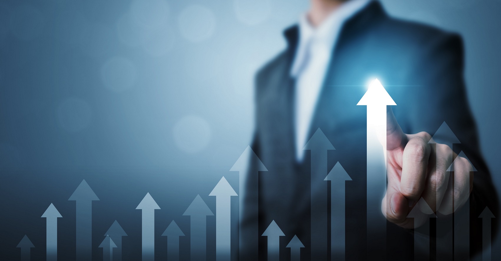 Photo of man touching arrow pointing up illustrates blog "How To Boost Productivity in Your Business"