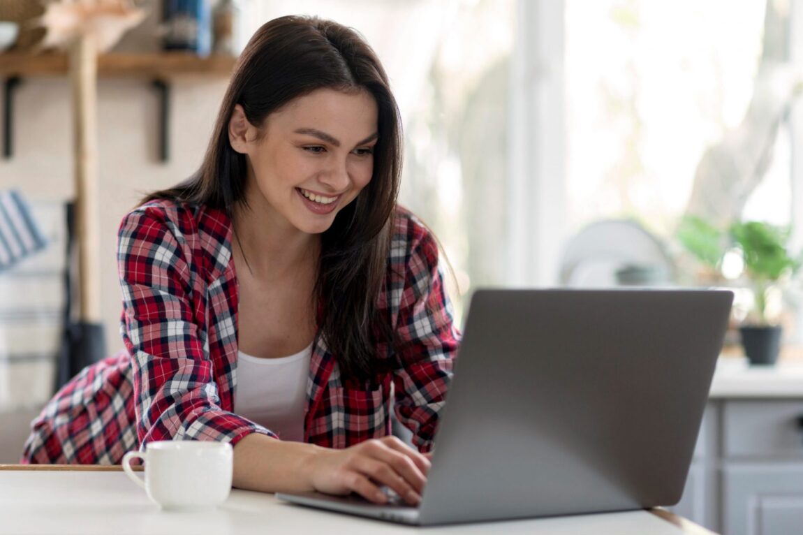 Photo of girl in front of computer illustrates blog: "How to Use Social Media to Advance Your Career"