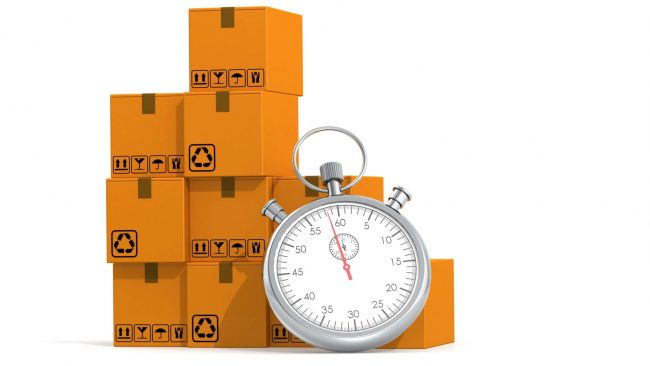 Photo of chronometer with cardboard boxes illustrates blog: "What Is Timeboxing?"
