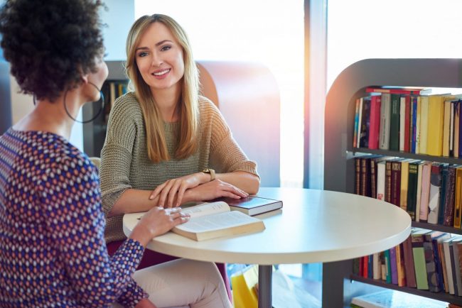 Photo of women talking illustrates blog: "Forming New Habits"