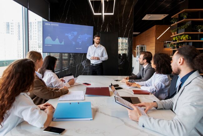 business-plan-FP People in meeting room illustrate blog "What Is a Business Plan and Why Do You Need One?"