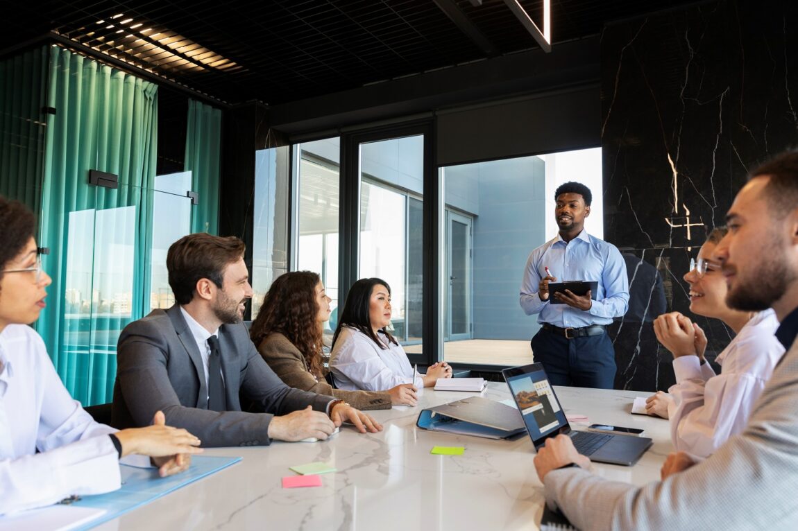 Business people at a meeting illustrates blog "Essential Tips for an Effective Business Strategy"