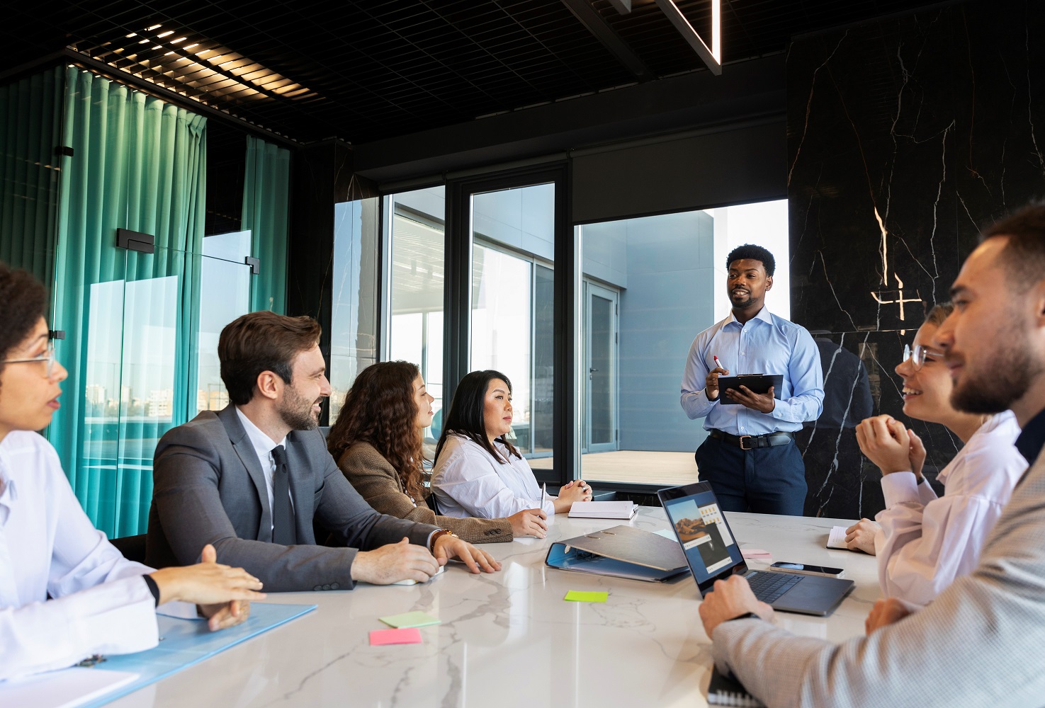 Business people at a meeting illustrates blog "Essential Tips for an Effective Business Strategy"