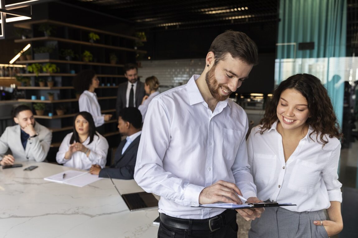 businesspeople-fp Businesspeople in office illustrate blog "How to Increase Employee Engagement"