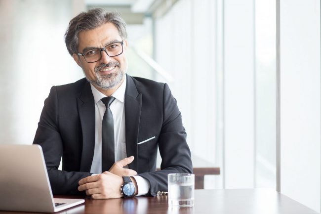 Photo of mature office worker illustrates blog: "4 Tips to Combat Ageism in the Workplace"